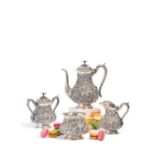 Four-piece coffee service decorated with dense floral relief