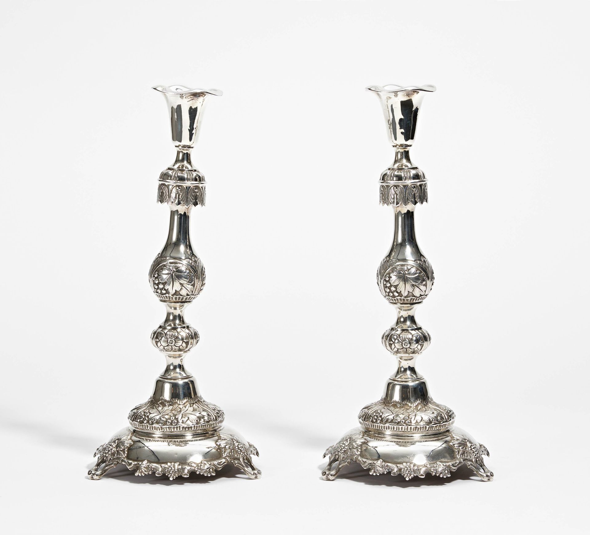 Pair of candlesticks with grape and vine décor