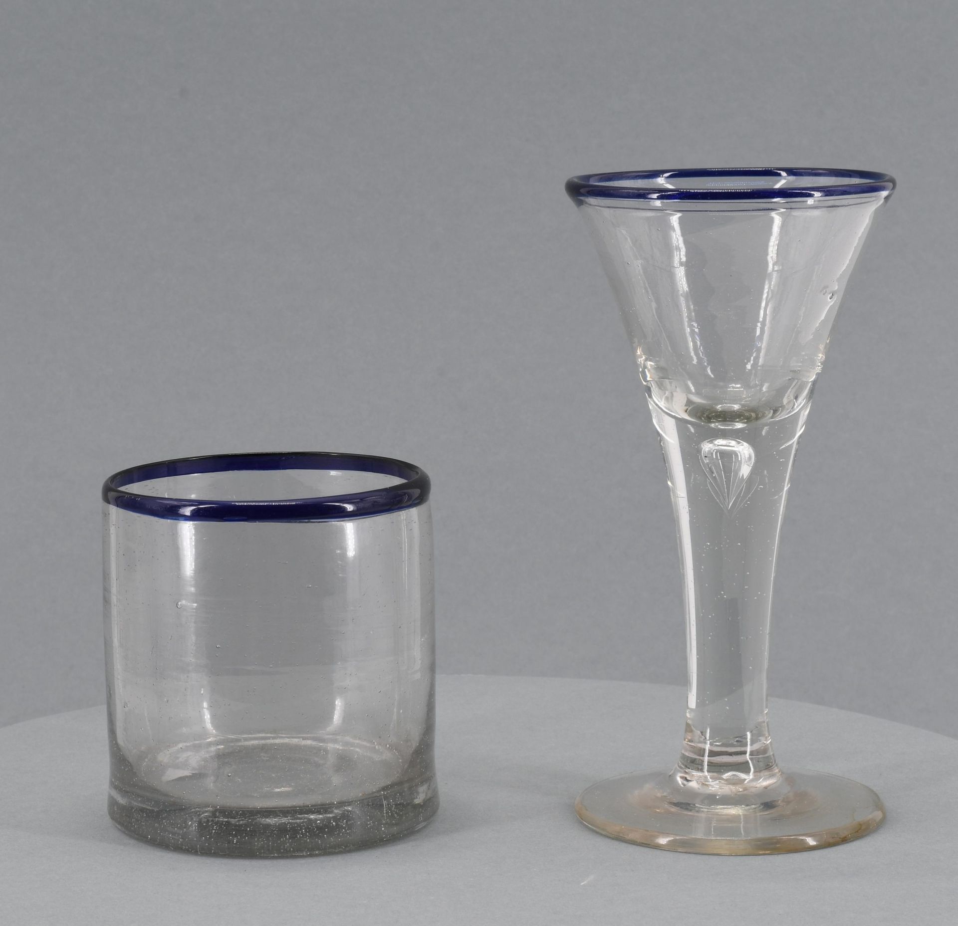 Two glasses with blue rim