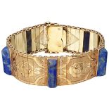 14K. Yellow gold richly decorated Art Deco bracelet set with lapis lazuli.