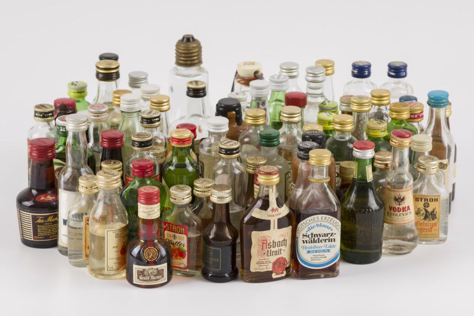 A large lot miniature flasks with spirits, 20th century.