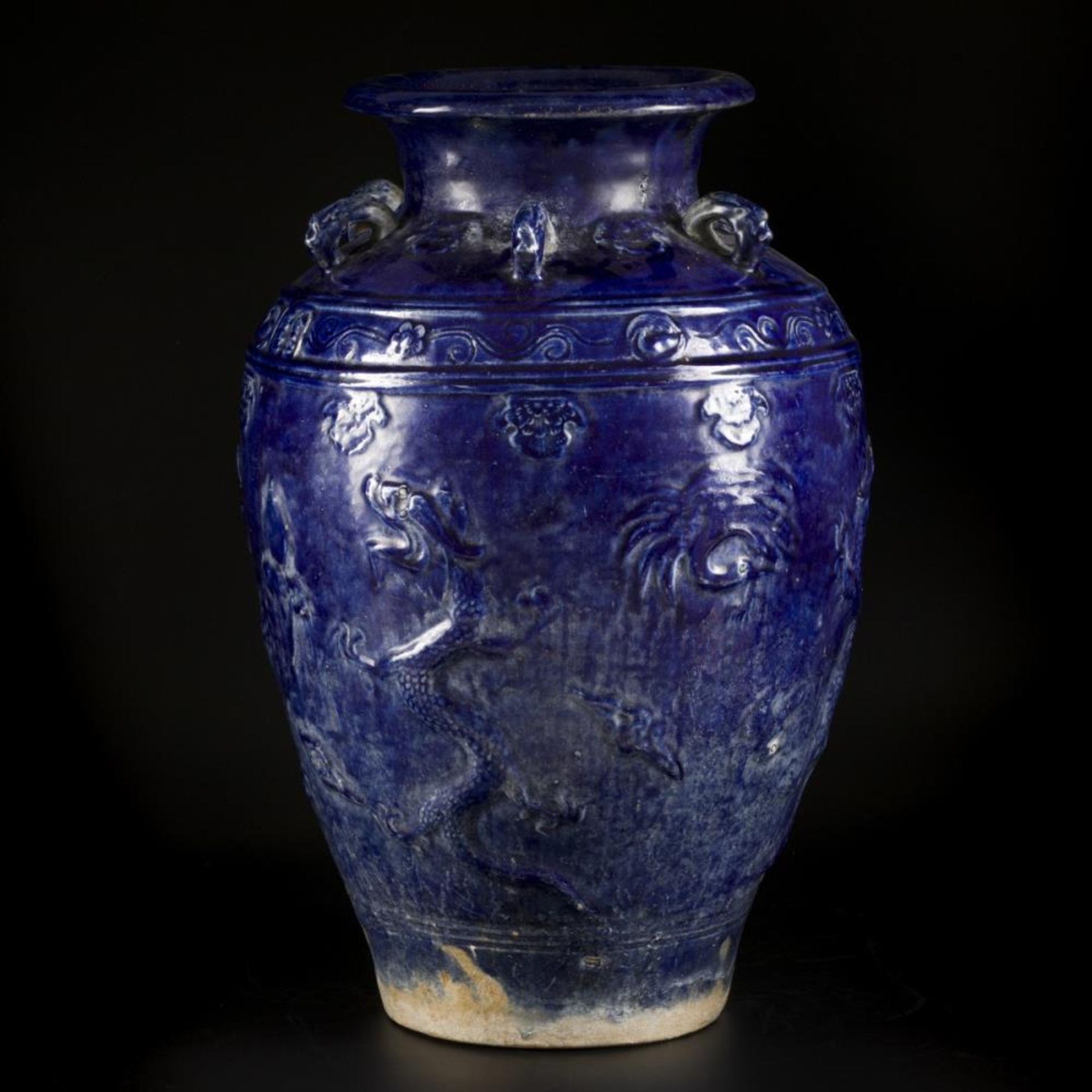 An earthenware blue glazed storage jar with dragon decoration, China, 19/20th century. - Image 3 of 18