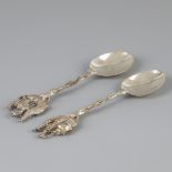 2 piece lot silver commemorative spoons.