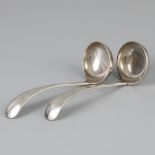 2 piece set of sauce spoons "Haags Lofje" silver.