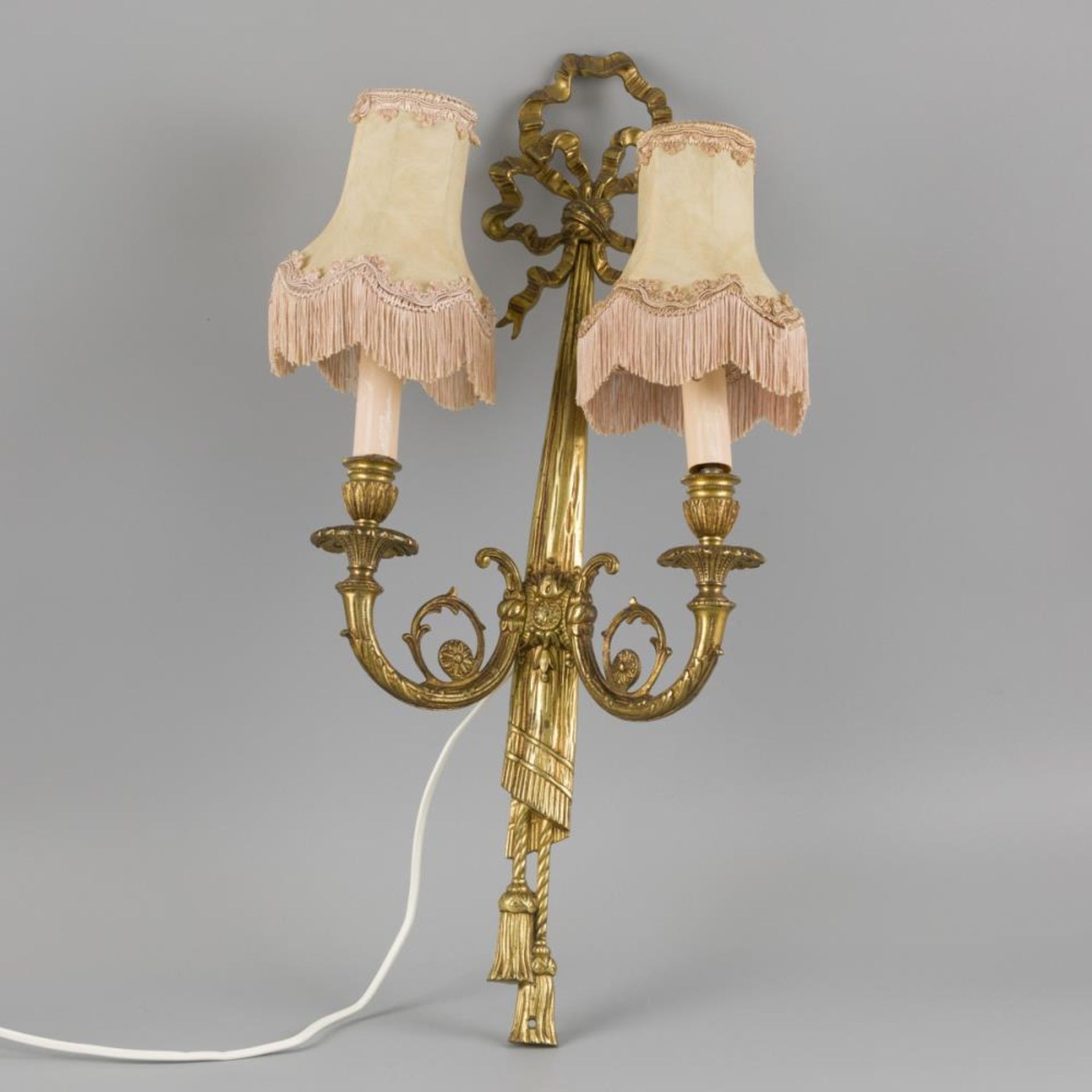 A two-light wall lamp / sconce in Louis XVI-style, brass, France, 20th century.