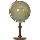 A globe on wooden stand. Ca. 1950.
