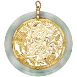 Circular jade pendant with a 20K. yellow gold floral openwork centerpiece.