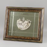 Framed mirror with ornament.