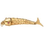 14K. Yellow gold antique flexible fish pendant set with rubies in the eyes.
