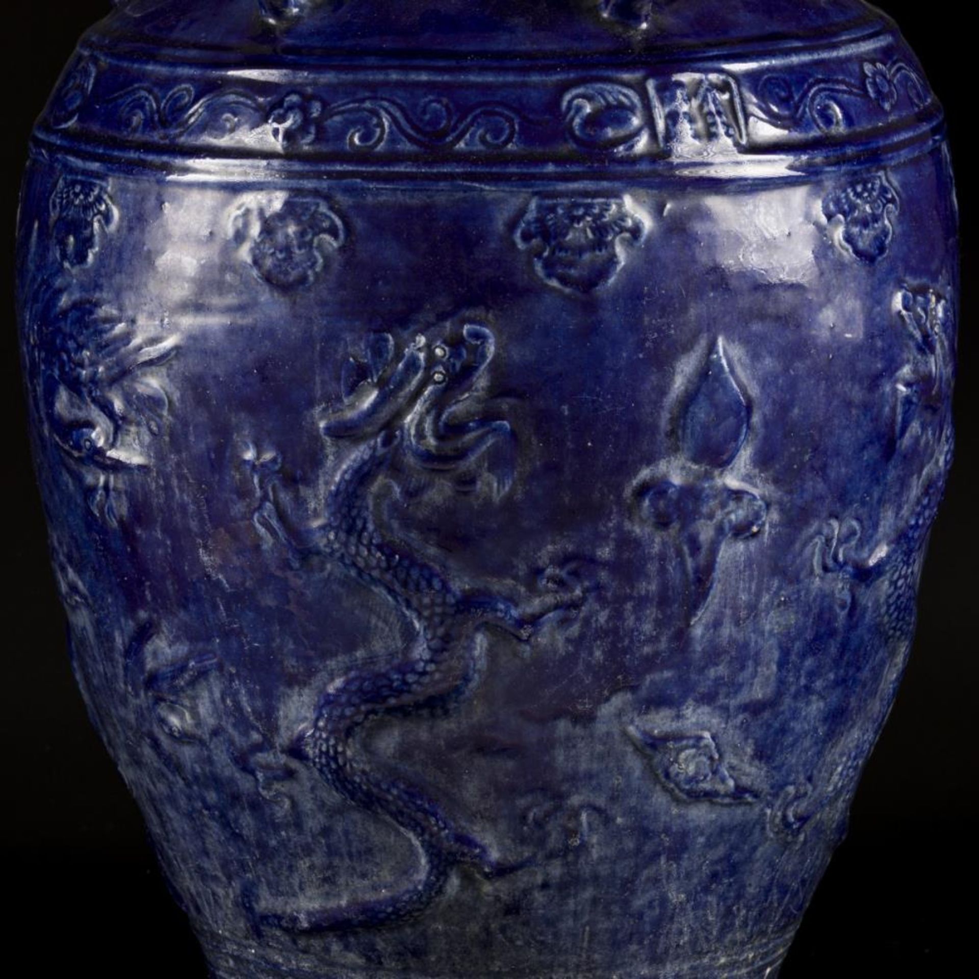 An earthenware blue glazed storage jar with dragon decoration, China, 19/20th century. - Image 12 of 18