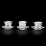 A set of (3) porcelain cups and saucers underglaze blue with gold floral decorations, China, 18th ce