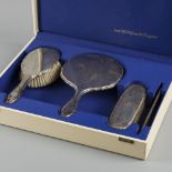 (4) piece silver dressing table set.