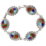 Quoc Turquoise Inc. sterling silver Native American bracelet with inlaid gemstones.