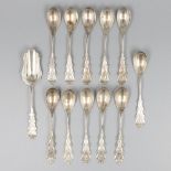 12-piece lot coffee spoons and sugar shovel silver.