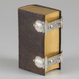 Bible with double locks silver.