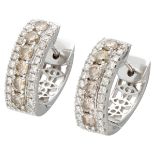 18K. White gold earrings set with approx 0.96 ct. diamond.