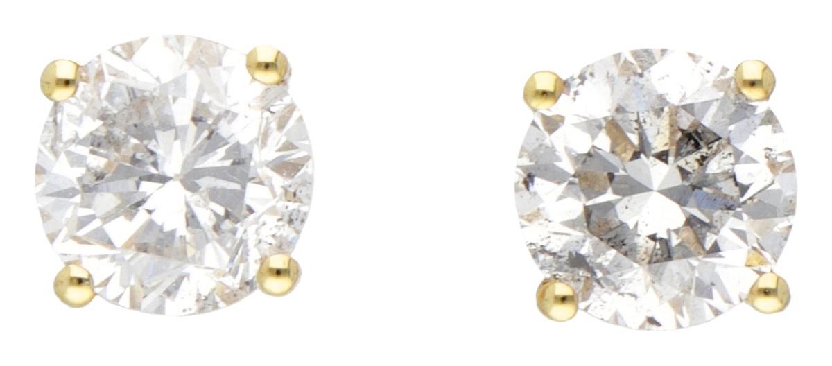 14K. Yellow gold solitaire earrings set with approx. 1.10 ct. diamond. - Image 2 of 3