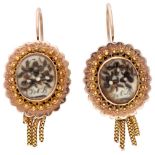 Antique BLA 10K. rose gold antique mourning earrings with representations of flowers made from hair.