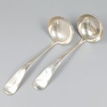 2-piece set of sauce spoons ''Haags Lofje'' silver.