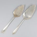 2-piece lot of silver cake scoops.