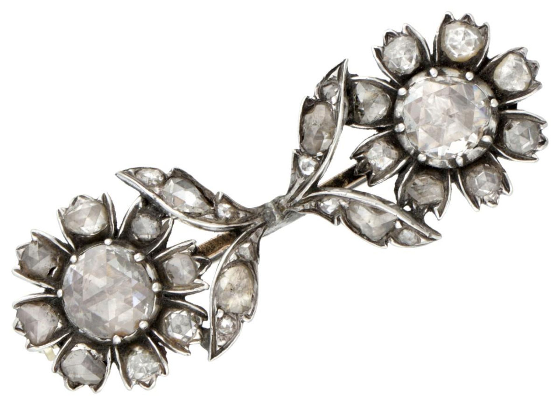 14K. Yellow gold/sterling silver flower brooch set with rose cut diamonds.