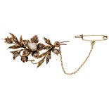 14K. Yellow gold floral-shaped brooch set with rose cut diamond.