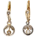 18K. Bicolor gold antique earrings each set with a diamond and pearl.