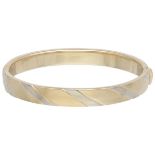 14K. Bicolor gold bangle bracelet.