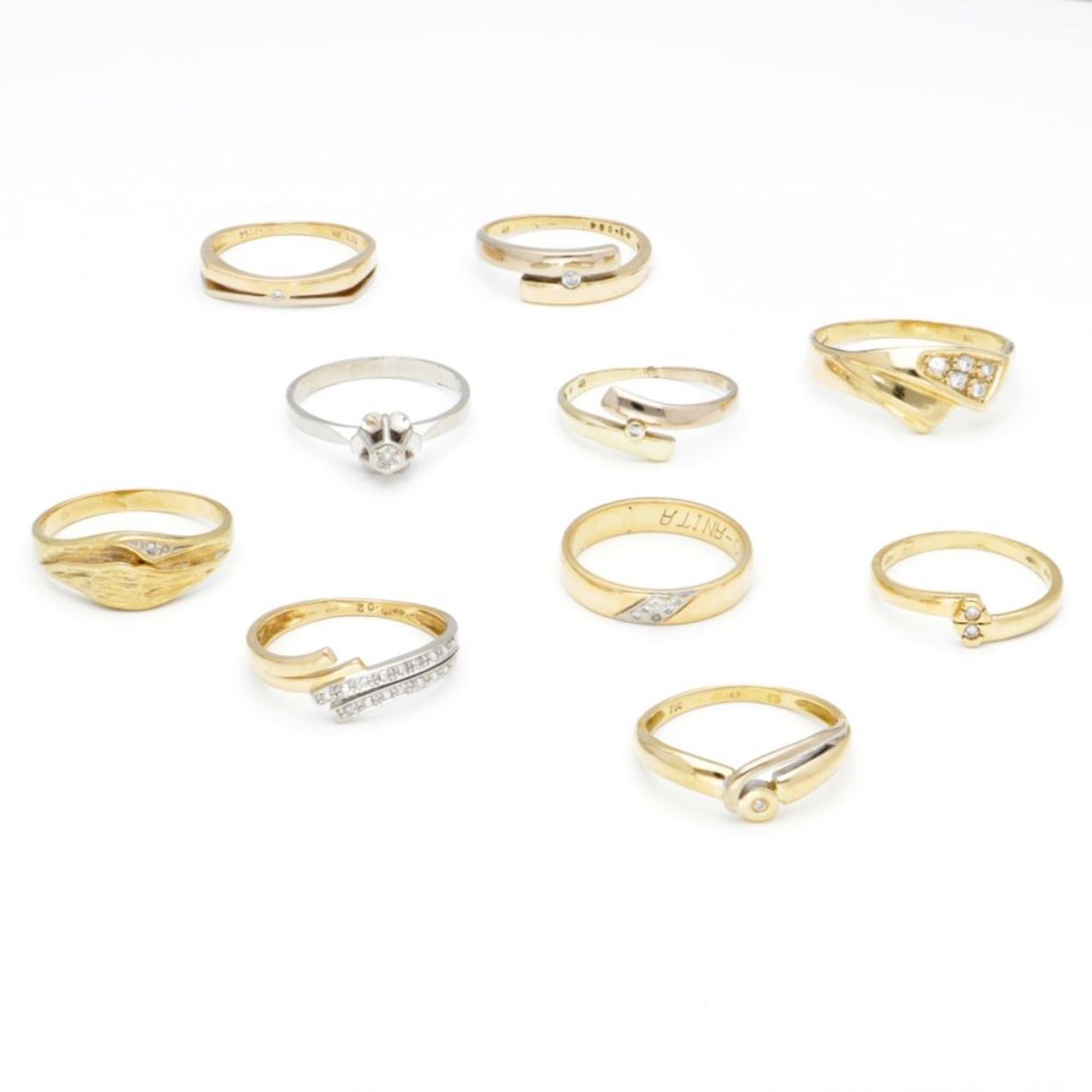 Lot of 14K. and 18K. gold rings, some of which are set with diamonds.