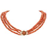 14K. Yellow gold three-row red coral necklace.