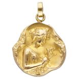 14K. Yellow gold Art Nouveau repoussé pendant with a graceful representation of a woman.
