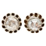 Antique 14K. yellow gold solitaire ear studs set with diamond in a buttercup setting.