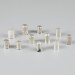 11-piece lot silver thimbles.