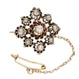 Antique 14K. rose gold brooch set with rose cut diamonds in buttercup settings.