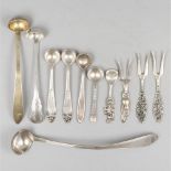 11-piece lot of various salt spoons, mustard spoons and cocktail forks silver.