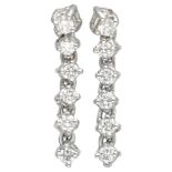 18K. White gold entourage earrings set with approx. 0.66 ct. diamond.