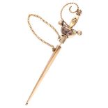 Vintage 14K. rose gold sword-shaped brooch set with ruby.