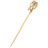 18K. Yellow gold Art Nouveau lapel pin set with diamond.