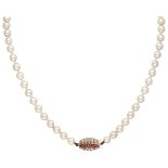 J. Köhle single strand Akoya pearl necklace with a 14K. white gold closure set with ruby.