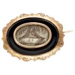 Antique 14K. rose gold mourning brooch with a representation made from hair set on onyx.
