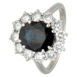 BLA 10K. white gold entourage ring set with approx. 1.30 ct. diamond and approx. 2.50 ct. sapphire.