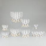 30-piece glass set with silver foot.