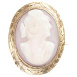 BLA 10K. yellow gold brooch set with a pink cameo with female in profile portrait.