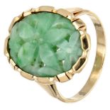 Vintage 14K. yellow gold ring set with a jade with a carved depiction of a flower.