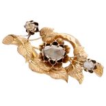 Antique 18K. yellow gold brooch with botanical details and rose cut diamonds.