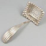 Silver sifter spoon.