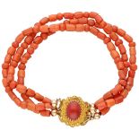 Antique three-row red coral bracelet with a 14K. yellow gold closure.