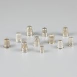 11-piece lot silver thimbles.