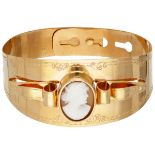 Antique 18K. yellow gold engraved bangle bracelet set with a cameo.