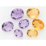 Lot of 7 mixed cut natural amethysts and citrines.